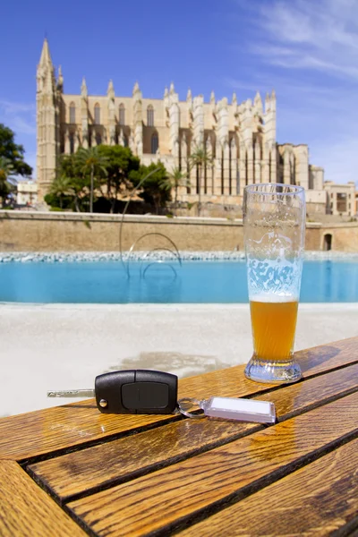 stock image Car rental keys on wood table in Palma de Mallorca cathedral