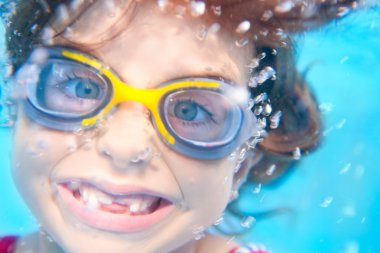 Children girl funny underwater with goggles clipart