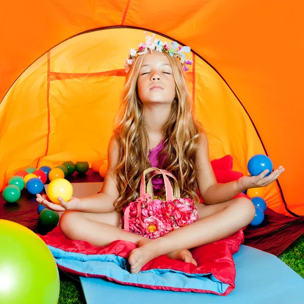 Children girl inside camping tent relaxing with yoga — Stock Photo, Image