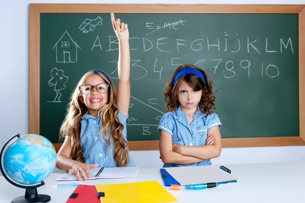 Clever nerd student girl in classroom raising hand — Stock Photo, Image