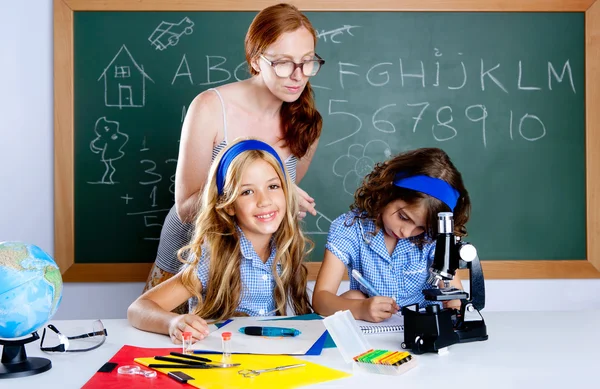 Kids students with nerd teacher woman at school — Stock Photo, Image