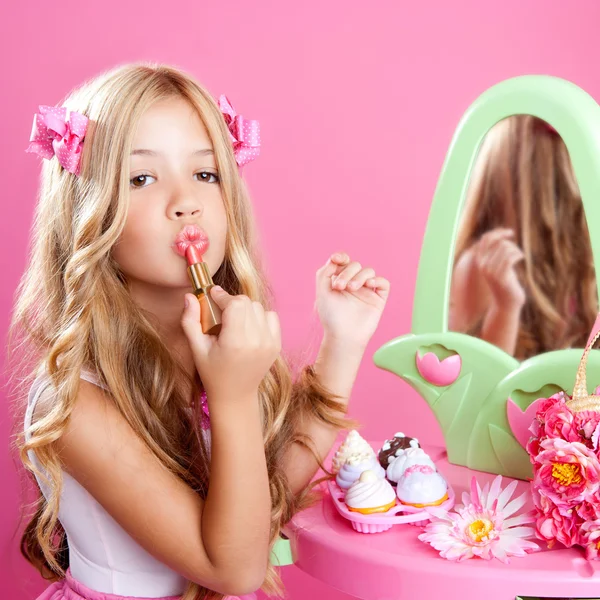 Children fashion doll little girl lipstick makeup pink vanity Stock Photo