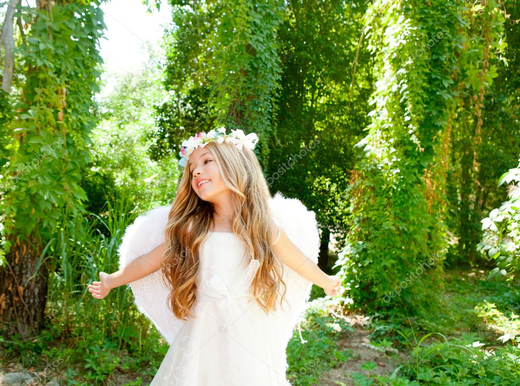 Angel children girl open arms in forest white wings