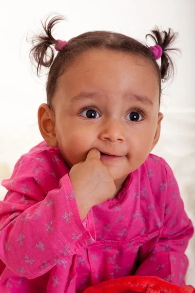 stock image Beautiful african american baby girl with his finger in the mouth