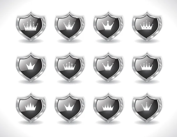 Escudos con coronas — Vector de stock
