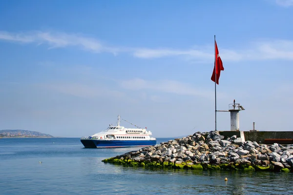 stock image The ship near coast in a bay