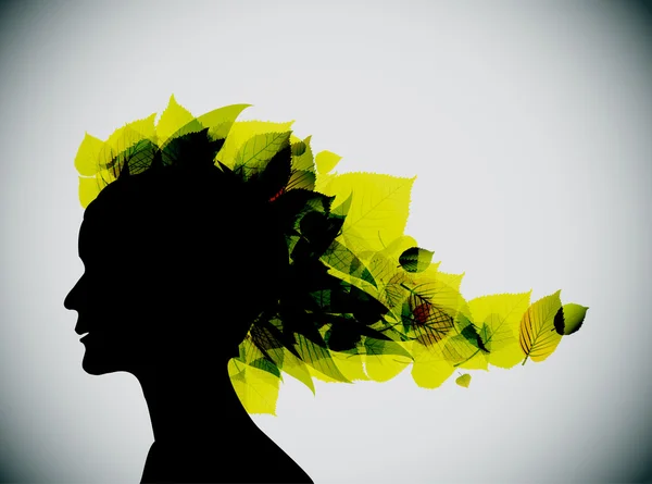 Silhouette tête de fille feuillage — Image vectorielle