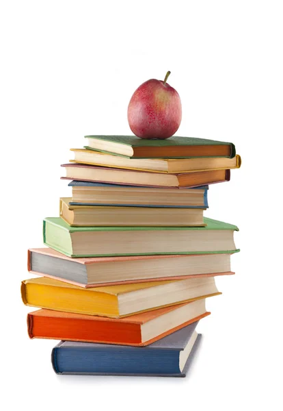 stock image A stack of colored books with apple