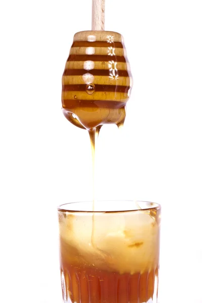 Мед с диппером — стоковое фото