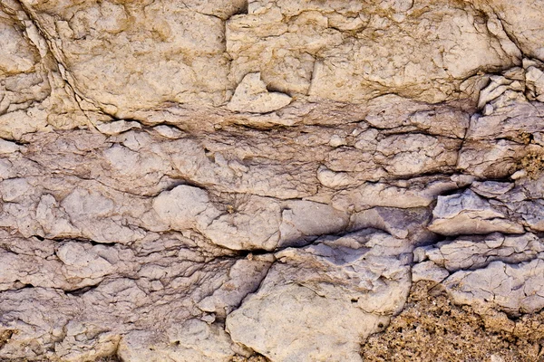 Worn textured stone wall — Stock Photo, Image
