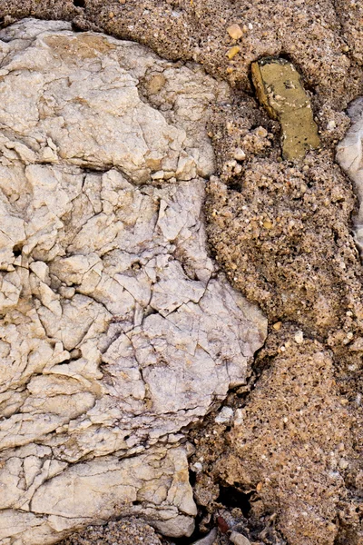 Worn textured stone wall — Stock Photo, Image