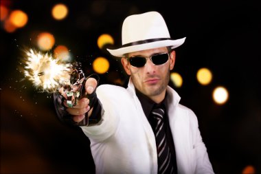 White suit gangster firing a gun clipart