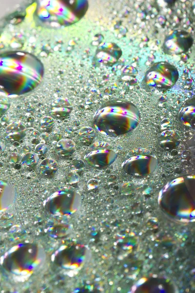 Gotas coloridas brilhantes de água — Fotografia de Stock