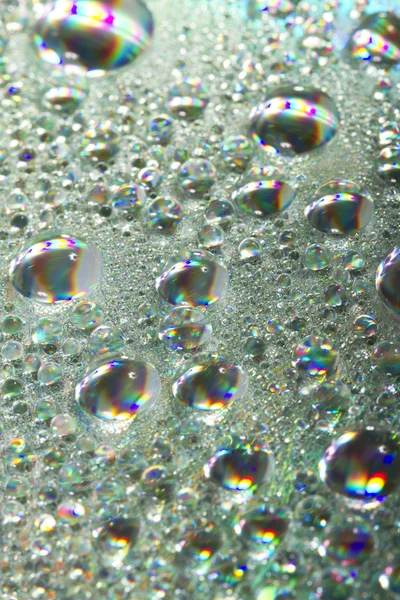 Blanka färgglada droppar vatten — Stockfoto