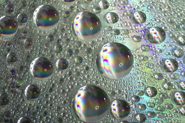 Блискучі барвисті краплі води — стокове фото