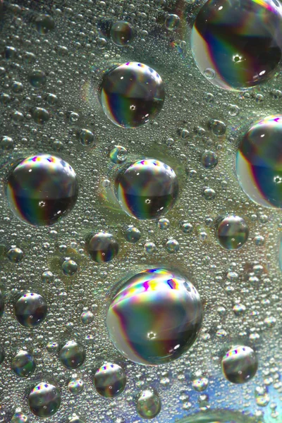 Lesklé barevné kapky vody — Stock fotografie