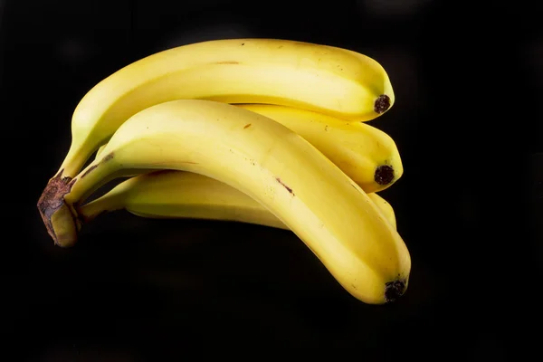 Banane su nero — Foto Stock