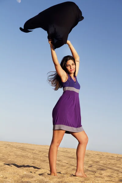Playful beautiful young girl with purple dress — Stock Photo, Image
