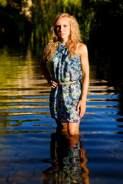 stock image Beautiful young girl on the river