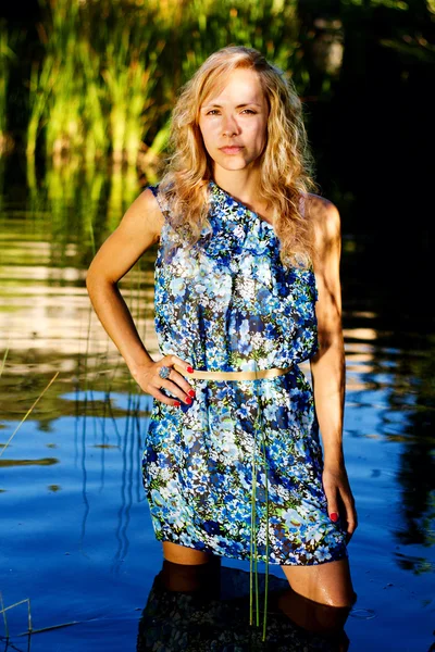 stock image Beautiful young girl on the river