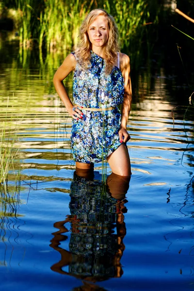 stock image Beautiful young girl on the river