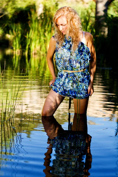 stock image Beautiful young girl on the river