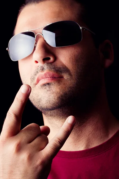 Male man with dark shades making signs — Stock Photo, Image