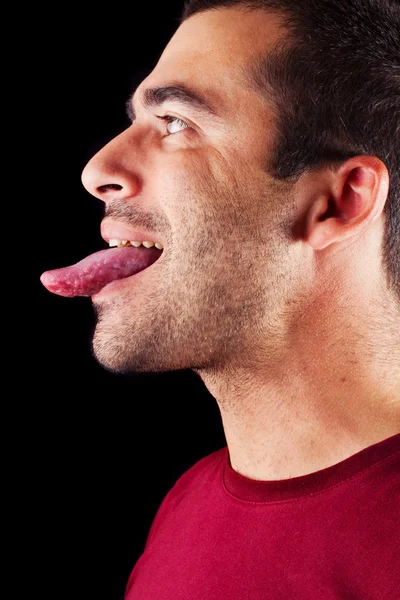Homem masculino com língua para fora — Fotografia de Stock