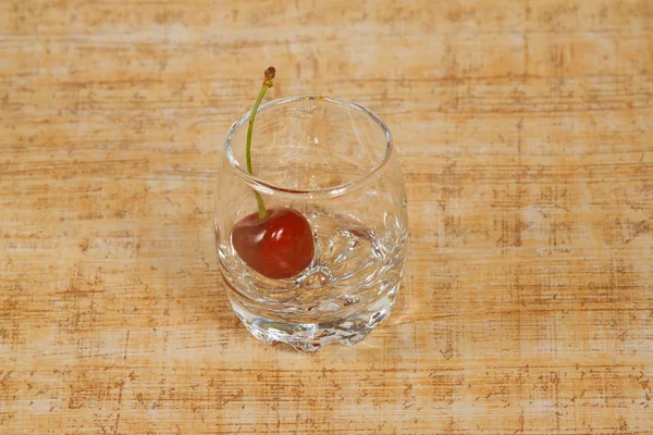 The glass of and red cherry — Stock Photo, Image