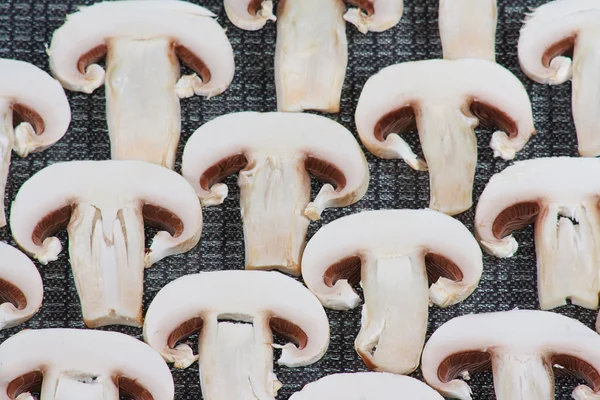 The slices of raw white champignons