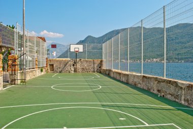 Basketball court at Adriatic coastal town clipart