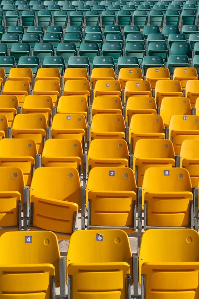 stock image Empty Stadium Seats, with one broken.