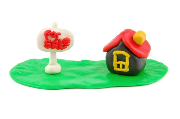 Plasticine house and For Sale real estate sign — Stock Photo, Image