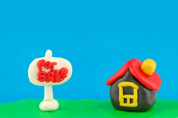 Plasticine house and For Sale sign with place for your text — Stock Photo, Image