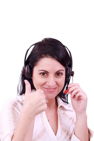 Χαμογελώντας κλήση κέντρο νεαρή γυναίκα με ένα ακουστικό αντίχειρα επάνω — Φωτογραφία Αρχείου