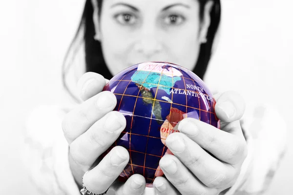 Woman holding the world in her hands — Stock Photo, Image
