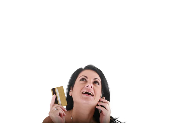 Portret van lachende jonge vrouw met behulp van mobiele telefoon op witte backgr — Stockfoto