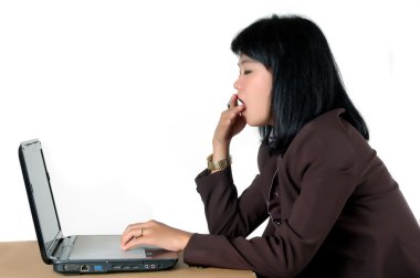 Asian young secretary's office yawning in his office clipart