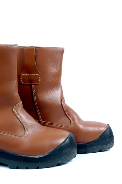 Um par de botas de couro marrom — Fotografia de Stock