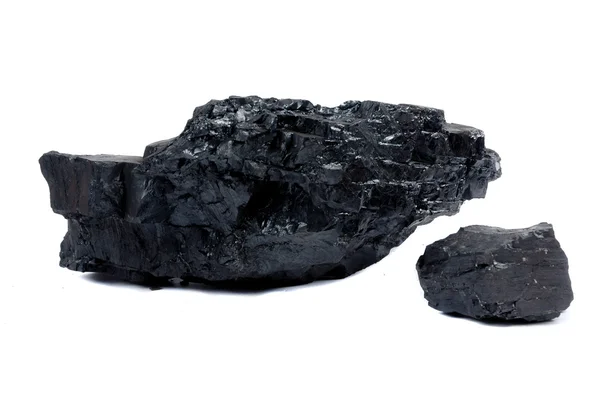 Un trozo grande y pequeño de carbón — Foto de Stock