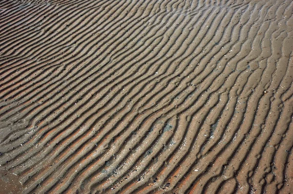 海边沙的模式正在消退 — 图库照片