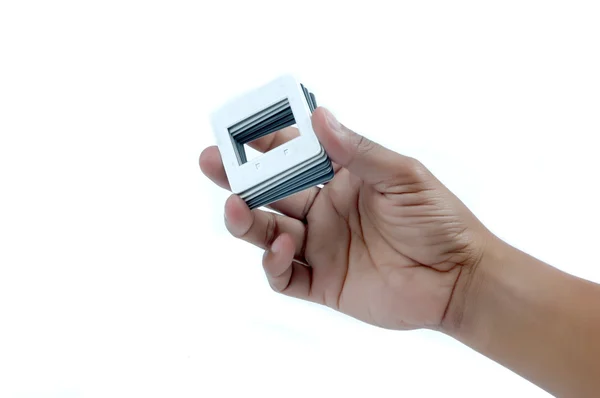 Mannelijke hand met een stapel van frames film dia. — Stockfoto