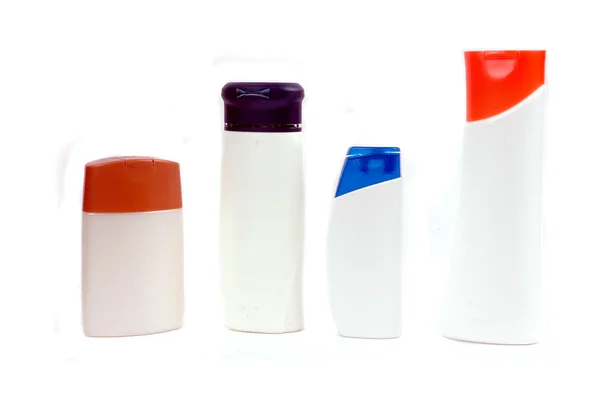 Vier Kunststoffbehälter für Badarmaturen — Stockfoto
