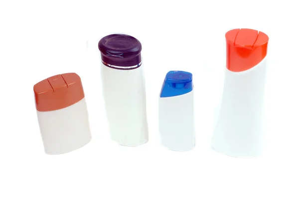 Fyra plastbehållare för bad fixturer — Stockfoto