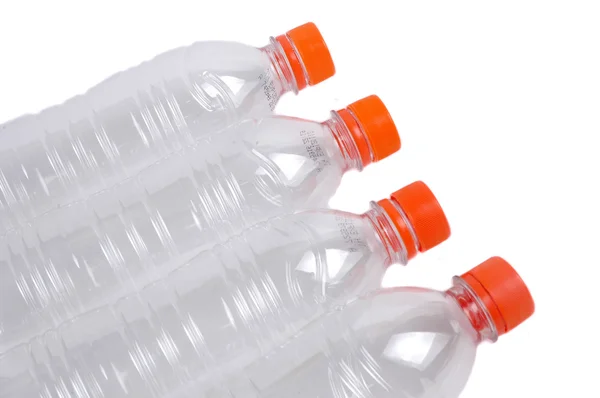 Чотири закриті пластикові пляшки — стокове фото