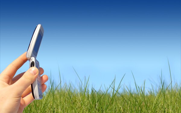 Mobile phone in hand.