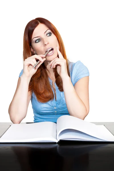 Stock image Portrait of young female sitting at desk thinking