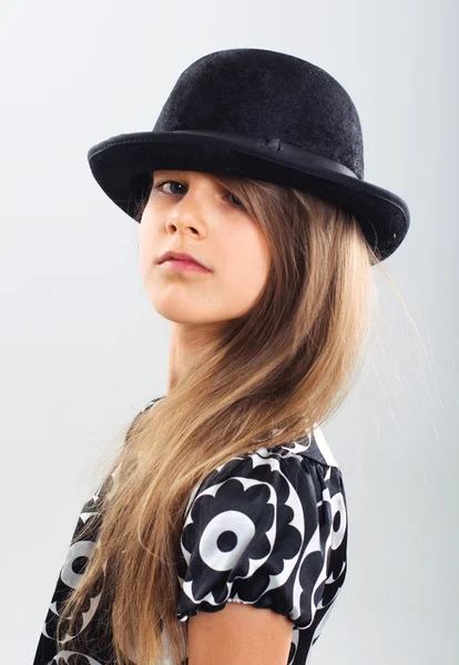 Stock image Pretty girl in a beautiful dress and a hat