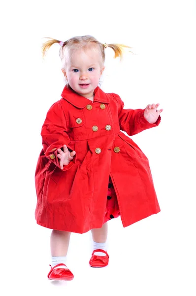 Cute little girl in a red dress. In the studio. Isolated — Stock Photo, Image