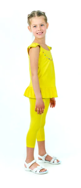 Foto van schattig klein meisje in gekleurde kleding op witte achtergrond — Stockfoto